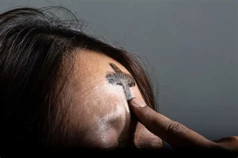 Ash Wednesday cross on forehead church ritual close up